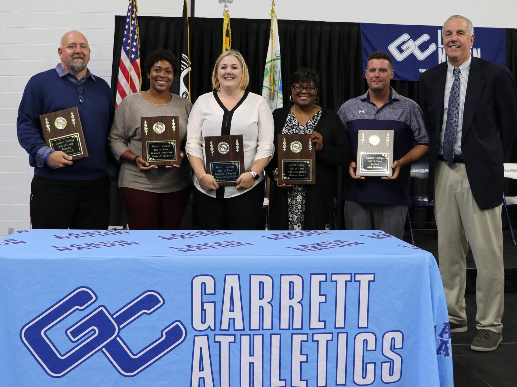 Pictured (from left to right) are members of the 2019 Athletics Hall of Fame class:  Mike Crosby (men&rsquo;s baseball), LaSha Anderson (women&rsquo;s basketball), Amanda Frantz-Shaffer (women&rsquo;s volleyball), Pam Butler, mother of Antonio Butler (men&rsquo;s basketball), accepting the award on his behalf; Eric Hallenbeck, GC&rsquo;s head baseball coach accepting the award for Mike DeLeeuw (men&rsquo;s basketball); Dennis Gibson, GC athletics director and head men&rsquo;s basketball coach.